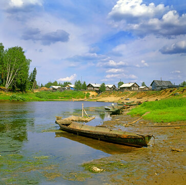 A typical very poor village on the bank of the river Pinega in Arkhangelsk region, northern Russia