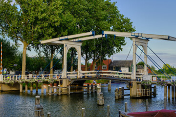 Weesp, Netherlands - July 05. 2022. Lange Vechtbrug wooden drawbridge over the river Vecht between Hoogstraat and Ossenmarkt.