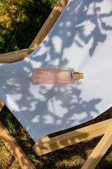 Sun cream bottle in chair on beach