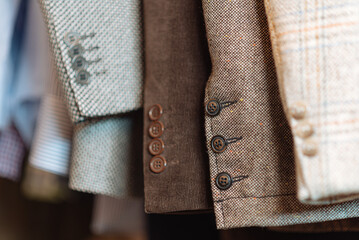 The sleeves of jackets in close up.
