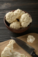 Raw, fresh organic cauliflower on a wooden background. Healthy eating, low carb diet concept
