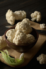 Raw, fresh organic cauliflower on a wooden background. Healthy eating, low carb diet concept