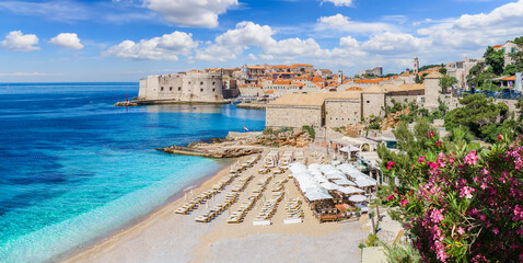Landscape with Banje beach and old town of Dubrovnik, dalmatian coast, Croatia - 515929041