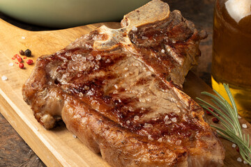 Focus on T-bone grilled steak.
