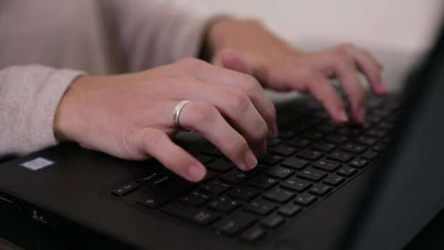 Working with the pc. closeup view of caucasian female hands typewriting with the laptop keyboard.