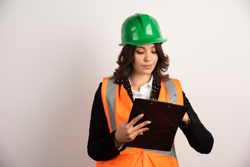 Woman engineer looking at important documents