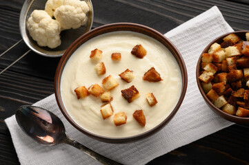 Creamy cauliflower soup with homemade croutons.
