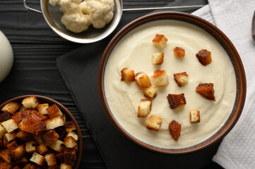 Creamy cauliflower soup with homemade croutons.
