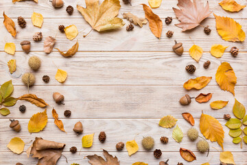 Autumn composition made of dried leaves, cones and acorns on table. Flat lay, top view
