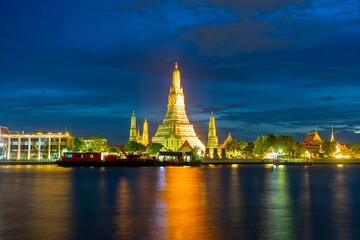 Wat Arun temple with Chao Phraya River At Night in Bangkok Thailand