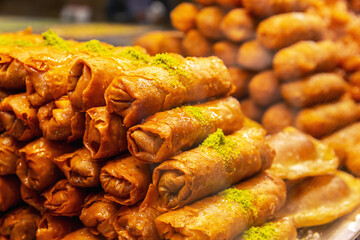 Traditional Dessert Turkish Baklava. Close up view of pastry with nuts and honey. Food background, copy space. Turkish or Middle eastern dessert concept