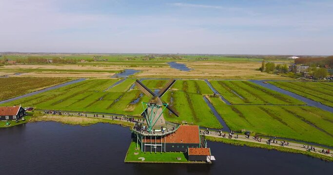 Zaanse Schans old dutch windmills spinning, Aerial view of a classic dutch landscape.