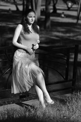 Black and white portrait of a woman in the street of a city