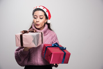 Yung santa girl cleaning dust from the gfits