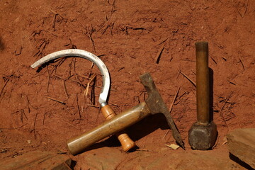Tool kit for works: Hammer, drilling machine,  screw, wood, red earth