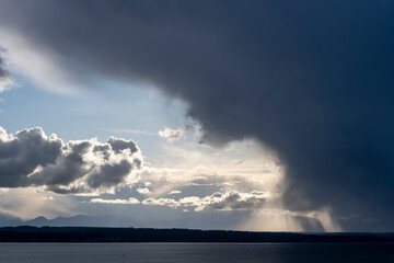 Naklejka na ściany i meble Rain clouds build over Puget Sound