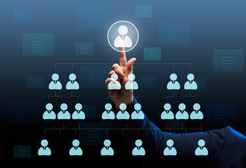 Businessman stands in front of a virtual hierarchy diagram in a company. Search for talented...