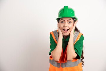 Successful woman in hardhat wearing uniform