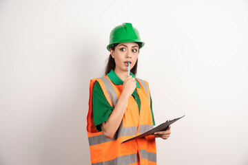 Engineer woman holding business paper and pencil