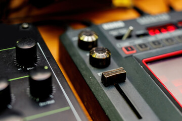 The surface with sliders of a sound mixer controller