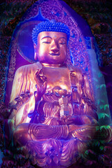 New Age Buddhism.  Photographic interpretation of ancient Buddhist statue in light of Internet depictions.