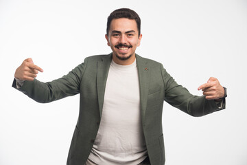 A businessman in dress code pointing himself
