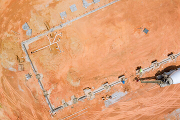 Concrete mixer trucks were used to pour concrete columns for the construction of a new house.