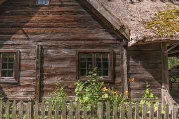 Fototapeta na wymiar Building details of an old preserved farmstead log house in a park a sunny summer day in Stockholm