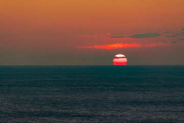 竜飛崎から見るだるま夕日