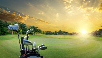The Golf club bag for golfer training and play in game with golf course background , green tree sun rays.	
