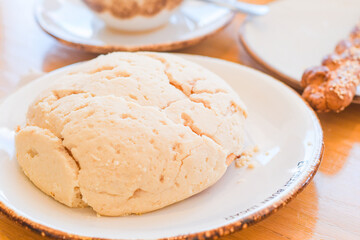 Concha Mexican pastry made by hand in a cafeteria.