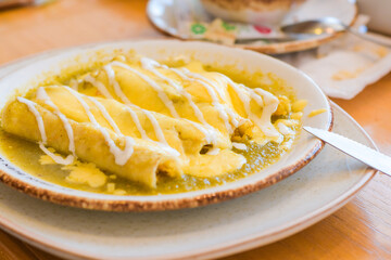 Enchiladas in green sauce, traditional cuisine of Mexico.