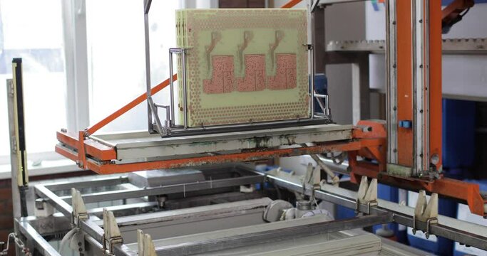 Electronic boards are tested on a special equipment in a laboratory. Manufacturing of microcircuits and microprocessors. Production of microelectronic equipment.