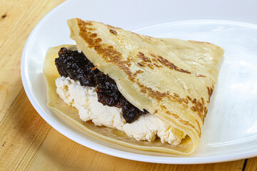Pancake with cottage cheese and jam