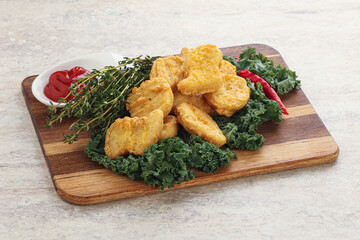 Crispy chicken nuggets with tomato ketchup