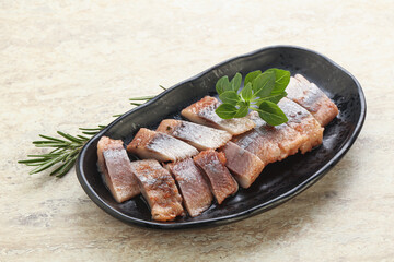 Delicous sliced herring fillet in grape sauce