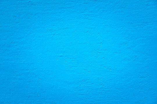 blue concrete wall with center light. Cement textured.