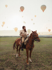 Girl riding a horse in Cappadocia