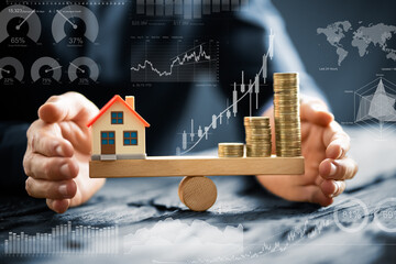 Businessperson Protecting House Model And Stacked Coins