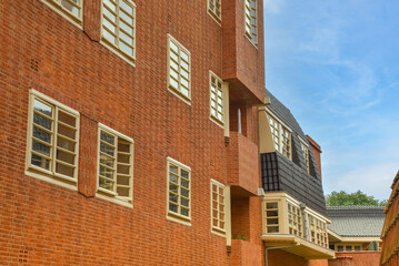 Amsterdam, Netherlands. June 2022. View of characteristic brick residential building in the style of the Amsterdam School in Spaarndammerbuurt, Amsterdam.