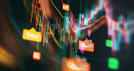 Concept of stock market and fintech. Blurry digital charts over dark blue background.