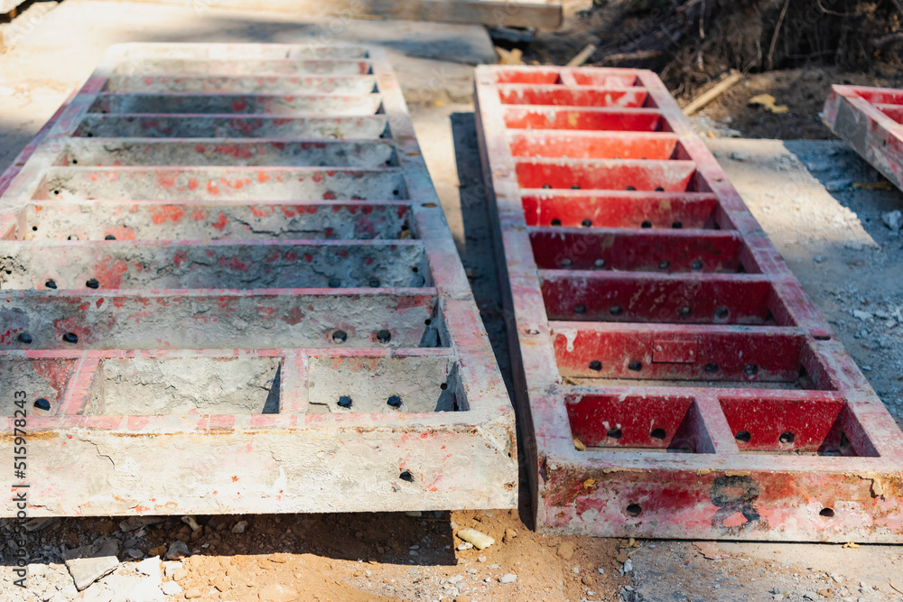 Poster building materials at a construction site. prepared materials and embedded parts for foundations at 