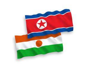 Fototapeta premium Flags of North Korea and Republic of the Niger on a white background