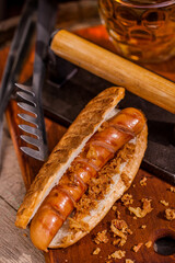 American hot dog with sausage and a glass of beer