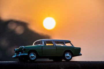 Plakat car on the sunset