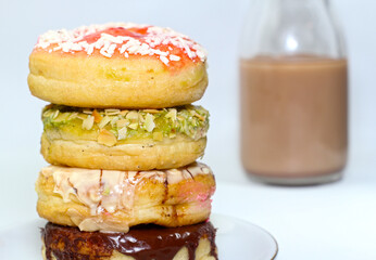 chocolate donut and a cup of chocolate milk