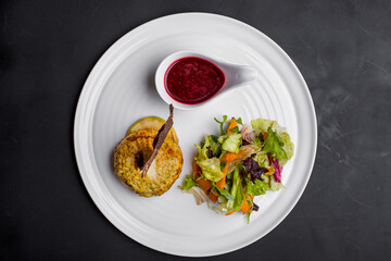 Fried tofu cheese with raspberry sauce and salad mix