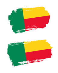 Obraz premium Set of two creative brush painted flags of Benin country with solid background