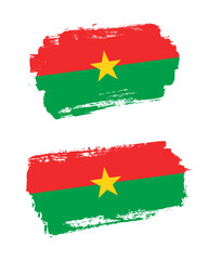 Set of two creative brush painted flags of Burkina Faso country with solid background