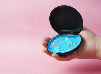 Invisible brace in case with hand hold